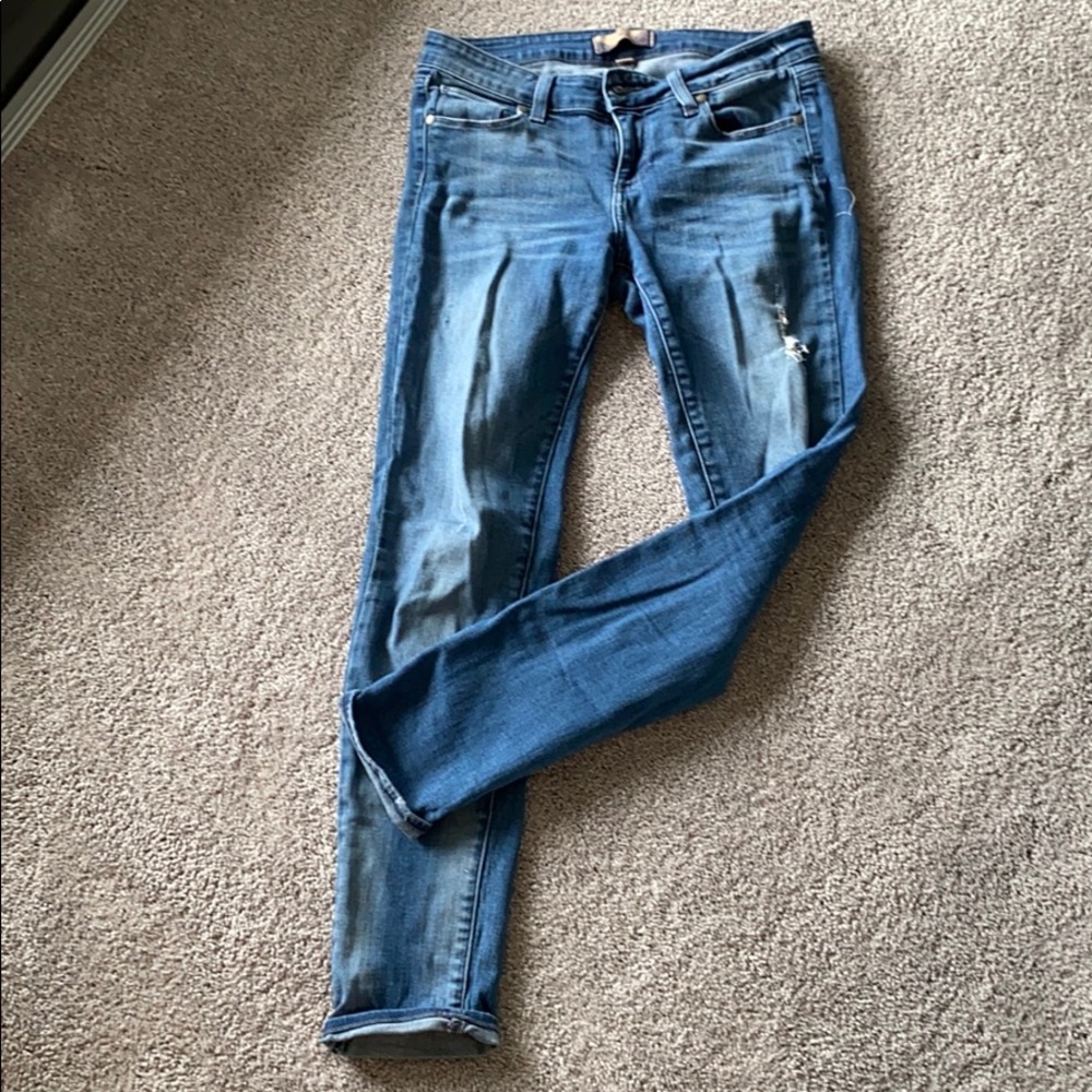 Lighter wash distressed skinny jeans